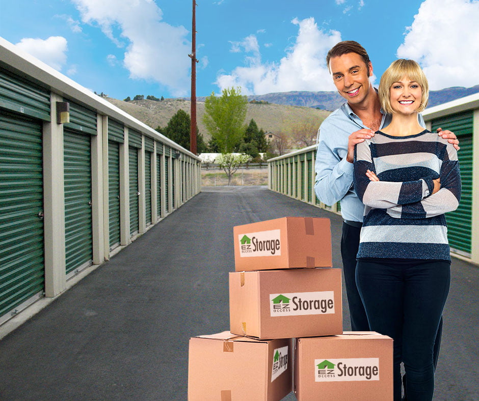 couples in front of EZ Access Storage units